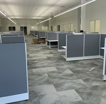 Modern corporate headquarters open plan workstations and executive offices